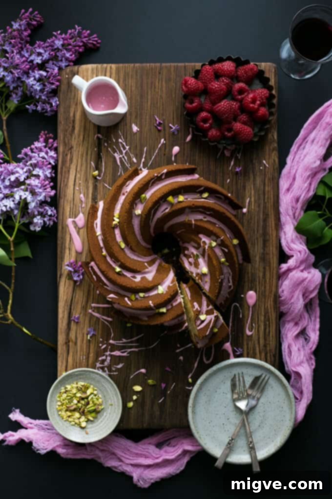 Blush Pink Vegan Lemon Bundt 6 Homemade vegan lemon bundt cake with luscious pink icing, garnished with crushed pistachio nuts | via @annabanana.co