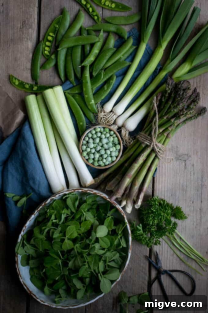 Asparagus, baby leeks, pea shoots and butter bean tart. A hearty and flavorful vegan recipe.