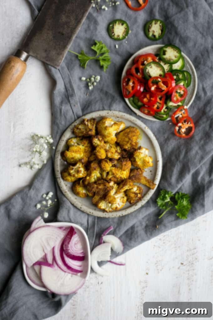 Savory Roasted Cauliflower Naan Pizza 6 Naan bread pizza topped with roasted cauliflower and chillies | via @annabanana.co