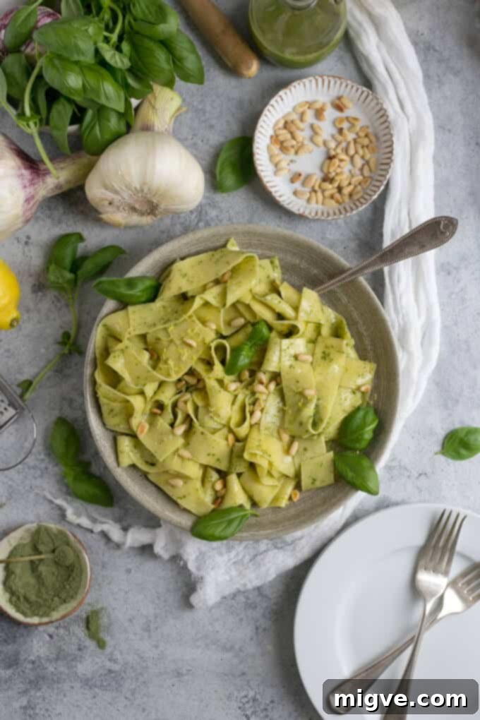 Zesty Lemon Pappardelle with Vibrant Basil-Kale Pesto 4 Platter of lemon pappardelle with basil and kale pesto, garnished with pine nuts and fresh herbs
