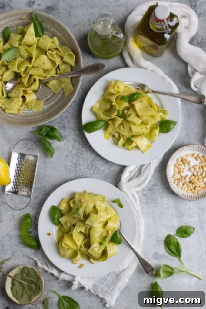 Zesty Lemon Pappardelle with Vibrant Basil-Kale Pesto 5 Close-up of fresh lemon pappardelle with pesto and toasted pine nuts