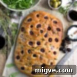 Rosemary focaccia with red grapes, sea salt and olive oil