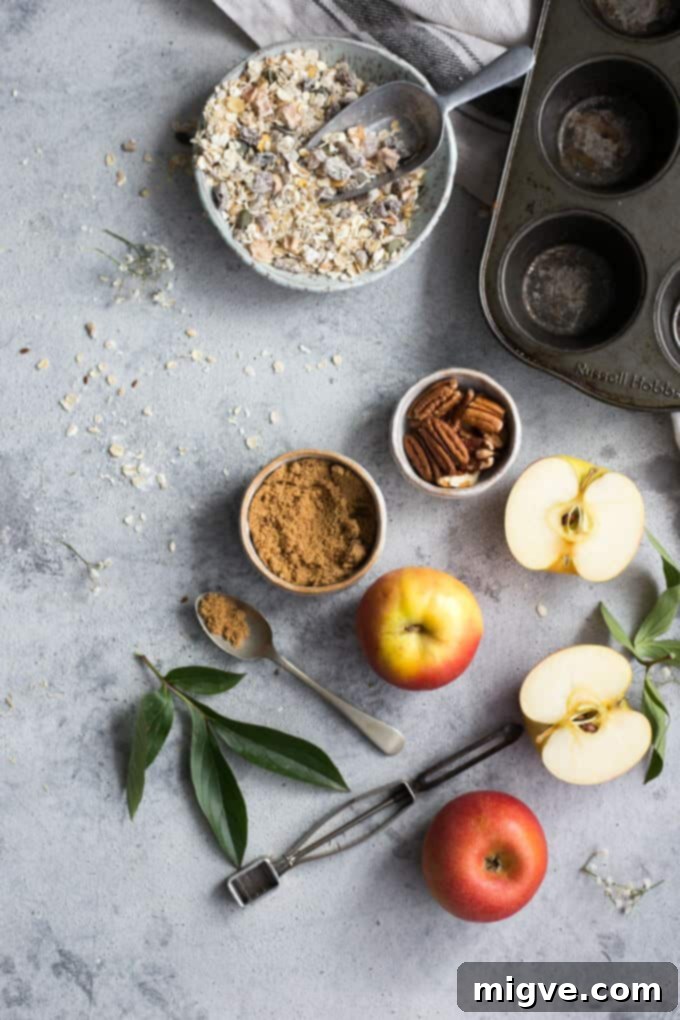 Delicious apple and pecan breakfast muffins with a crunchy topping, perfect for a morning treat
