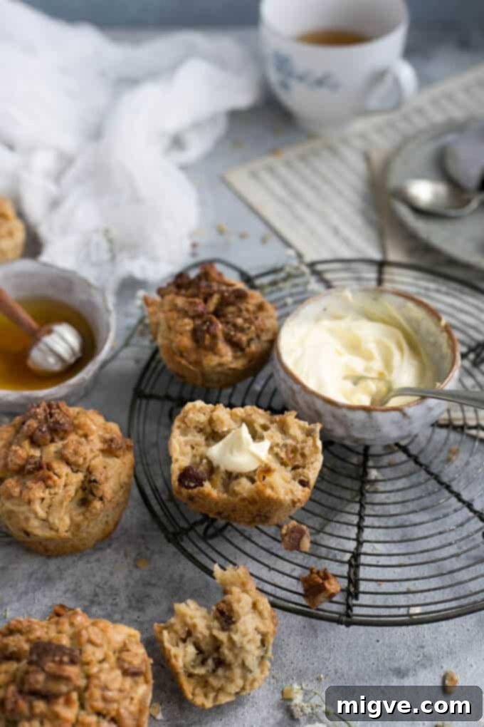 Hearty breakfast muffins brimming with fresh apple chunks and crunchy pecans, a perfect homemade recipe