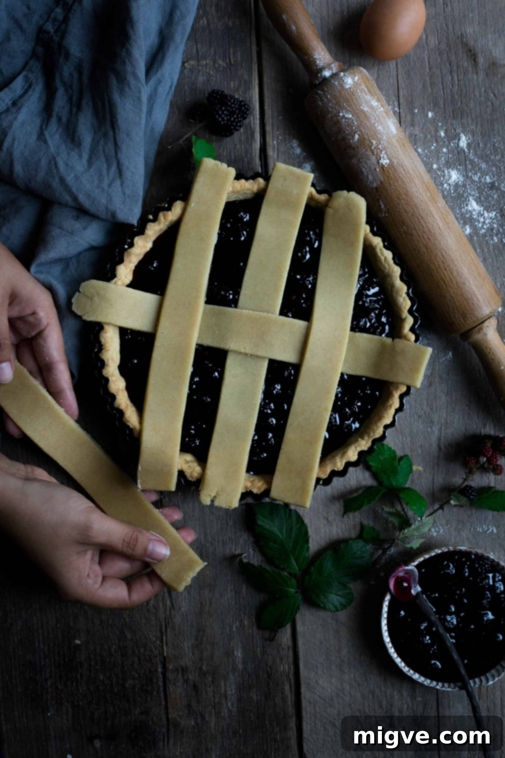 Homemade blackberry tart with intricate lattice top