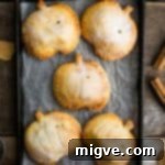 Warm Spiced Apple Pumpkin Pockets 13 Spiced Apple and Pumpkin Hand Pies, perfect for Halloween treats.