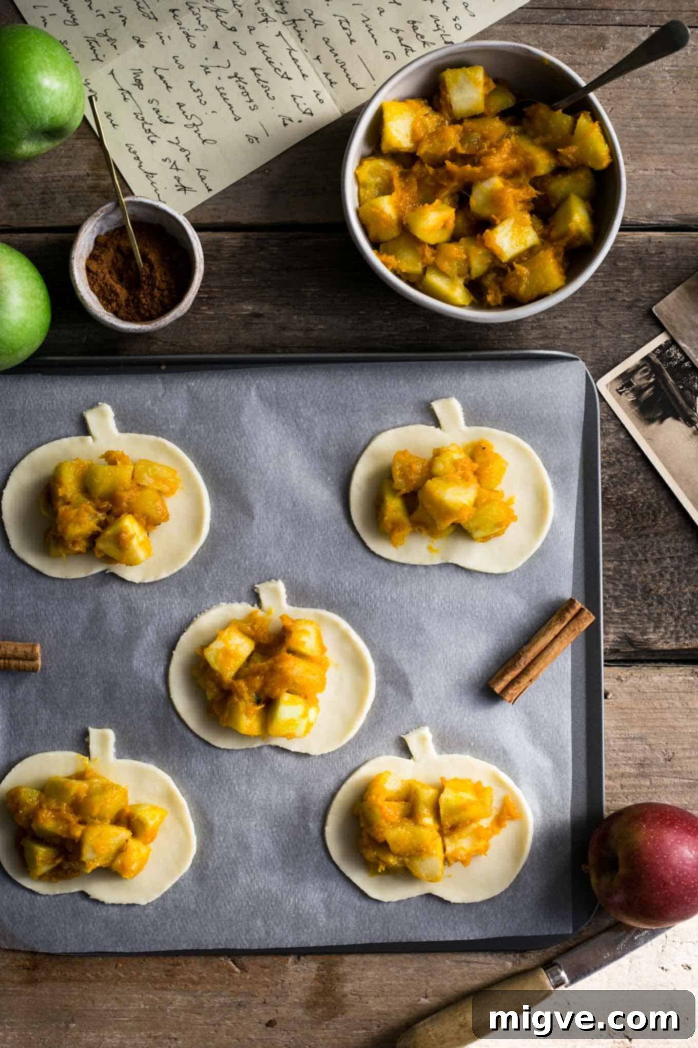 Warm Spiced Apple Pumpkin Pockets 3 Close-up of golden-brown spiced apple and pumpkin hand pies, ideal for fall baking.