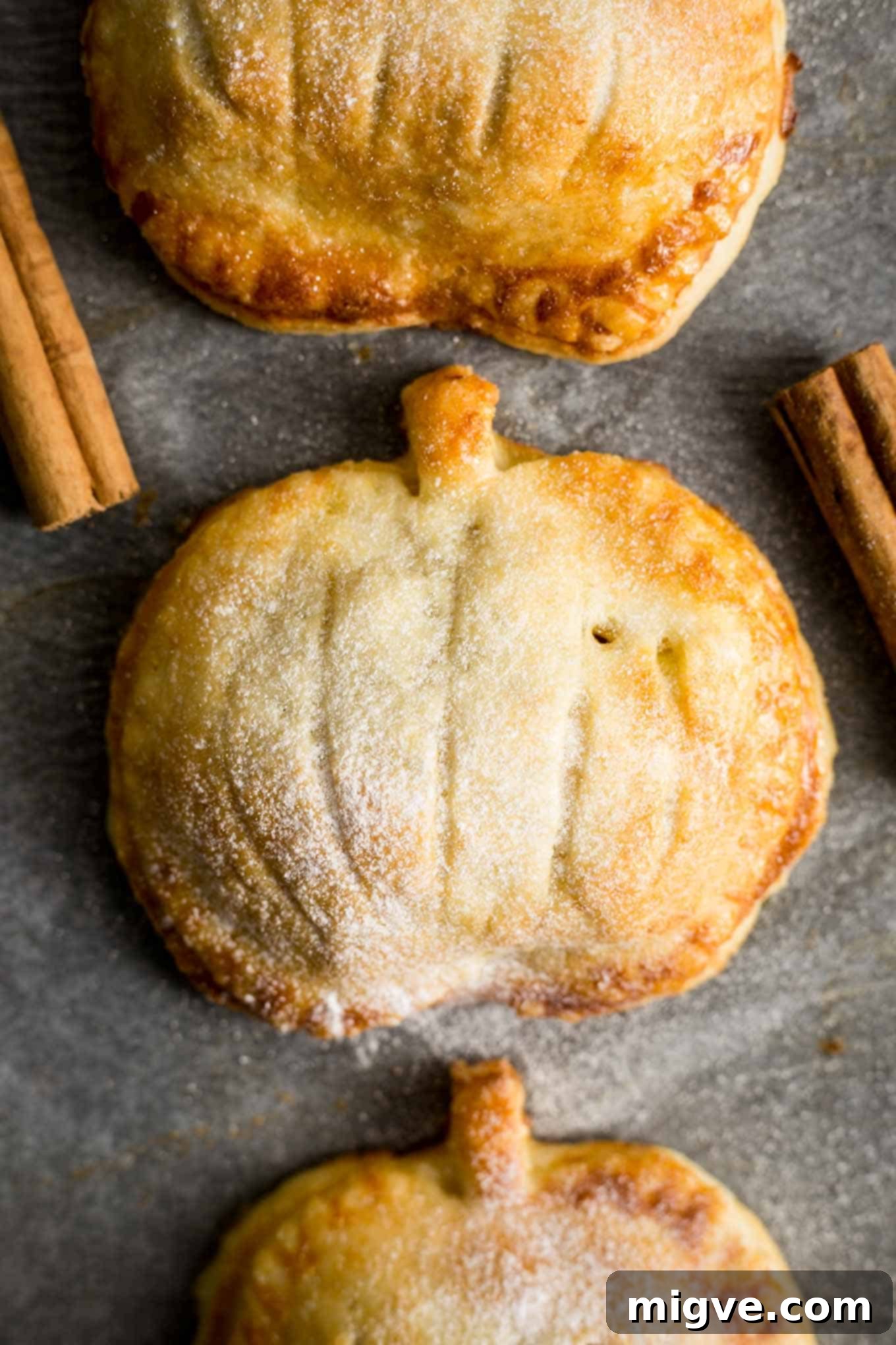Warm Spiced Apple Pumpkin Pockets 7 Hand pies filled with spiced apple and pumpkin, showcasing their golden crust.
