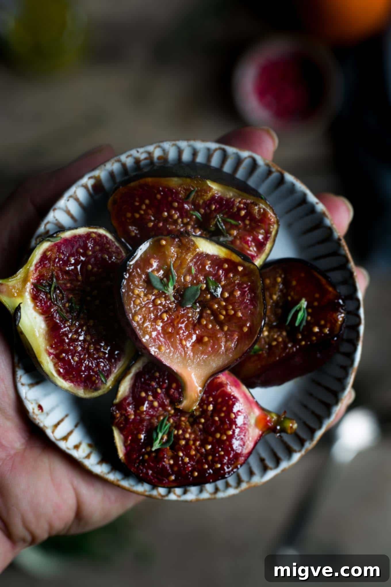 Close-up of a vibrant roasted pumpkin salad with figs and walnuts, emphasizing its vegan and seasonal appeal.