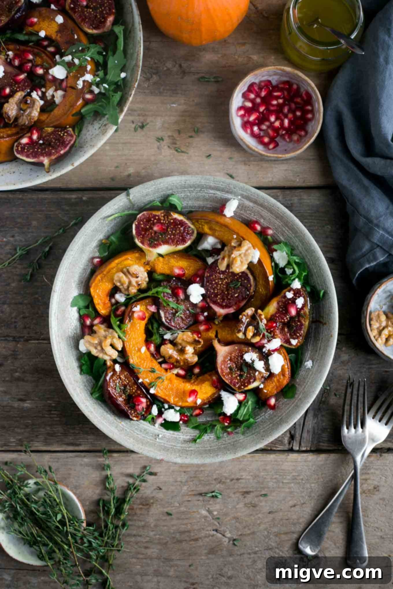 A generous serving of delicious seasonal roasted pumpkin and walnut salad, highlighted as a vegan and healthy option.