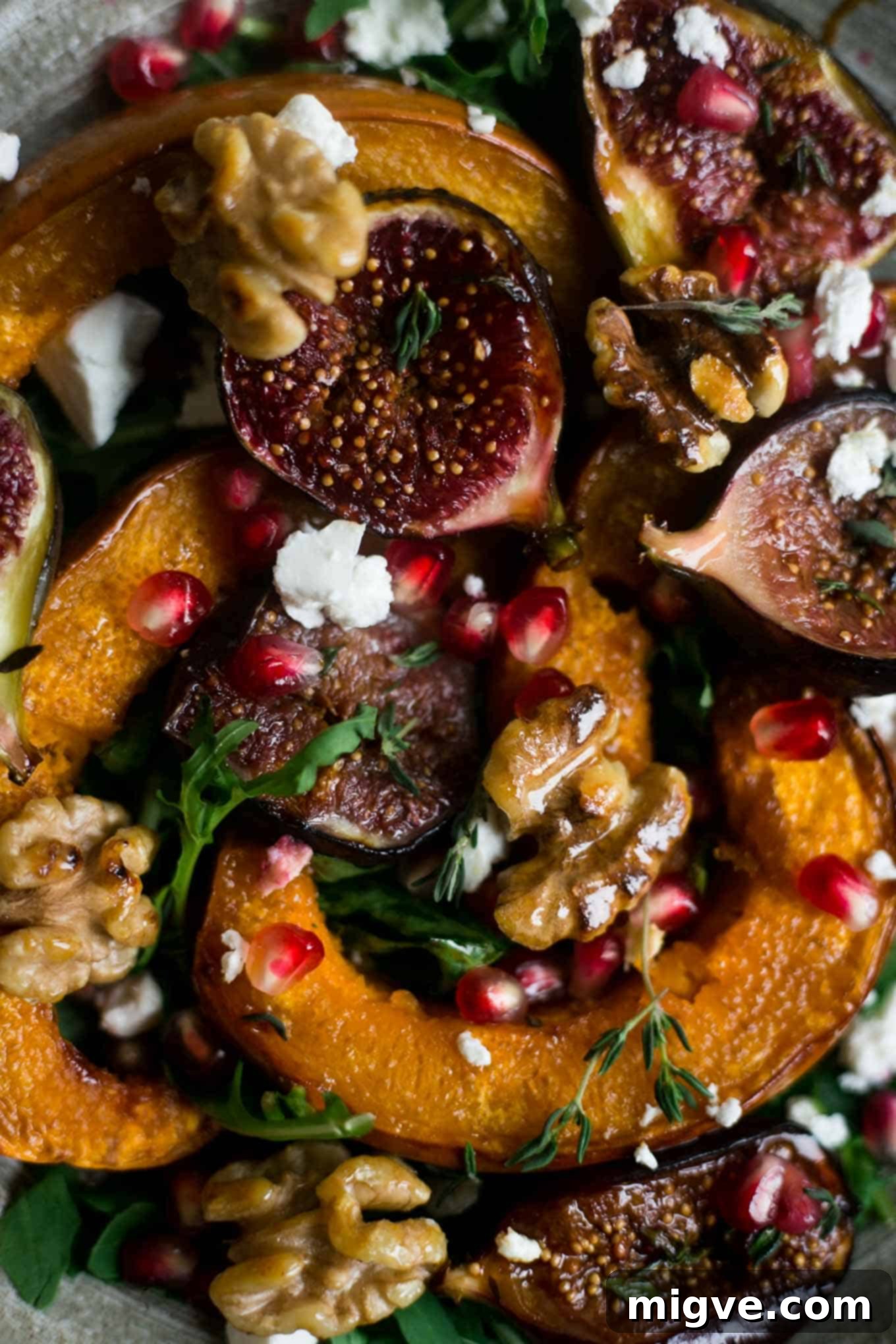 Roasted pumpkin and walnut salad, made vegan with feta and enhanced by sweet figs, showcasing its appeal.