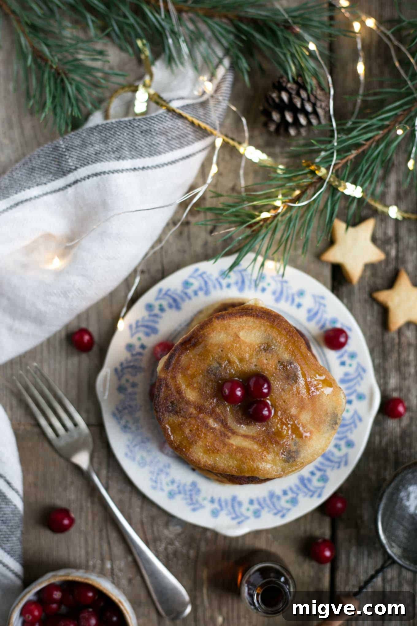 Super soft and fluffy vegan pancakes with boozy rum-soaked raisins, a dairy-free delight.