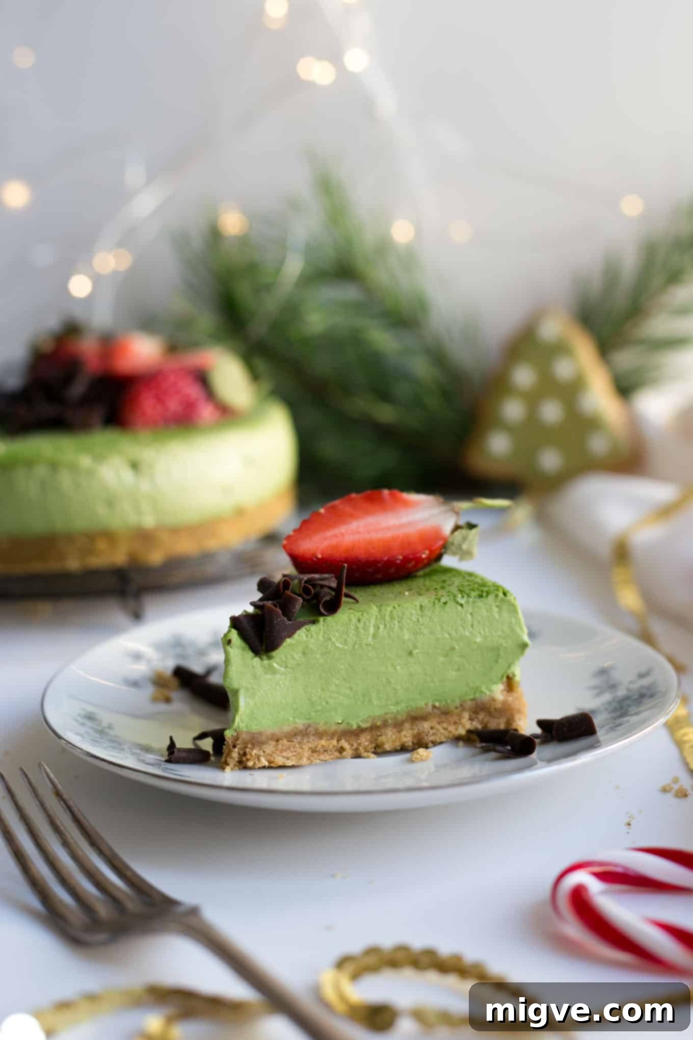 Close-up of the smooth and creamy filling of a matcha ginger cheesecake, highlighting its rich texture and natural green color, suitable for vegan diets.